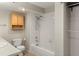 Bathroom with a shower-tub combination and light wood cabinet at 6380 S Boston St # 391, Greenwood Village, CO 80111