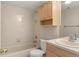 Bright bathroom with a tub, toilet and vanity with sink; a functional layout for relaxation and convenience at 6380 S Boston St # 391, Greenwood Village, CO 80111