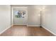 Bedroom featuring a large window and hardwood floors at 6380 S Boston St # 391, Greenwood Village, CO 80111