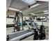 Well-equipped gym with a variety of exercise machines and mirrored walls promoting an active lifestyle at 6380 S Boston St # 391, Greenwood Village, CO 80111