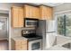 Kitchen featuring stainless steel appliances and light wood cabinetry at 6380 S Boston St # 391, Greenwood Village, CO 80111