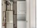 Convenient laundry closet with stacked washer and dryer units, maximizing space and utility at 6380 S Boston St # 391, Greenwood Village, CO 80111