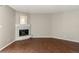 Spacious living room featuring a fireplace, neutral walls, and hardwood floors at 6380 S Boston St # 391, Greenwood Village, CO 80111