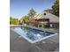 Sparkling swimming pool reflecting the sky, surrounded by seating for relaxation and leisure at 6380 S Boston St # 391, Greenwood Village, CO 80111