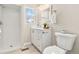 Updated bathroom featuring a walk-in shower, modern vanity, and a neutral color palette at 2023 S Idalia St, Aurora, CO 80013