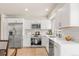 Modern kitchen featuring stainless steel appliances, white subway tile backsplash, and ample counter space at 2023 S Idalia St, Aurora, CO 80013