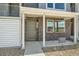 Close-up of a brick townhome entrance, showing the door, number, and quick move-in sign at 647 Skyhook St, Erie, CO 80516