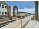 View of modern townhomes showcasing individual garages, balconies, and contemporary design at 647 Skyhook St, Erie, CO 80516