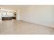 Open-concept living area featuring hardwood floors and a view into the kitchen at 647 Skyhook St, Erie, CO 80516