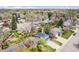 Aerial view showcases the property nestled among mature trees, offering privacy and a serene residential environment at 12175 W 68Th Pl, Arvada, CO 80004