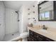 Bright bathroom with a walk-in shower, modern fixtures, and ample storage space at 12175 W 68Th Pl, Arvada, CO 80004