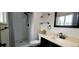 Bathroom with walk-in shower, modern fixtures, and updated vanity at 12175 W 68Th Pl, Arvada, CO 80004