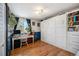Cozy bedroom featuring a custom Murphy bed, desk area, and built in storage at 12175 W 68Th Pl, Arvada, CO 80004