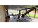 Backyard covered patio featuring string lights, outdoor dining, and lounging area at 12175 W 68Th Pl, Arvada, CO 80004