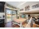 Charming dining area with a view of the backyard and seamless transition to the cozy living room at 12175 W 68Th Pl, Arvada, CO 80004