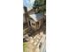 Charming shed with a stone path, windows, and unique architectural details, nestled in a serene backyard at 12175 W 68Th Pl, Arvada, CO 80004