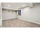 Finished basement has vinyl floor and recessed lights, with a small window at 17943 E Bates Ave, Aurora, CO 80013