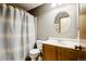 This charming bathroom features a vanity and a shower with a star-themed shower curtain at 17943 E Bates Ave, Aurora, CO 80013