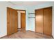 A simple room with wood floors and built-in shelves providing convenient storage at 17943 E Bates Ave, Aurora, CO 80013