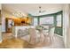 Charming dining area with hardwood floors, a ceiling fan, and lots of natural light at 17943 E Bates Ave, Aurora, CO 80013