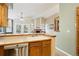 Open kitchen featuring stainless steel appliances and a view of the living room with a fireplace at 17943 E Bates Ave, Aurora, CO 80013