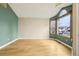Inviting living room featuring hardwood floors, neutral paint, and ample natural light at 17943 E Bates Ave, Aurora, CO 80013