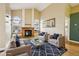 Bright living room featuring a cozy fireplace, large windows and contemporary furnishings at 17943 E Bates Ave, Aurora, CO 80013