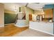 Open floor plan featuring a staircase, a combined kitchen and living area with bright natural light at 17943 E Bates Ave, Aurora, CO 80013