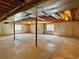Large unfinished basement with multiple windows providing natural light and concrete floors at 1688 Aquamarine Dr, Brighton, CO 80603