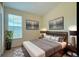 Comfortable bedroom featuring modern décor, large window, and soft, neutral color palette at 1688 Aquamarine Dr, Brighton, CO 80603