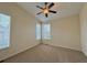 A bright bedroom is illuminated by windows and finished with neutral carpet at 1688 Aquamarine Dr, Brighton, CO 80603
