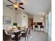 Dining room setup with pendant lighting, modern decor, and a pass-through to the kitchen at 1688 Aquamarine Dr, Brighton, CO 80603