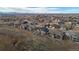 Aerial view of homes, landscape, and mountains at 12664 Ulster St, Thornton, CO 80602