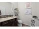 Powder room with modern vanity and decor at 12664 Ulster St, Thornton, CO 80602