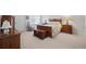 Cozy bedroom with a wooden bed frame and dresser at 12664 Ulster St, Thornton, CO 80602