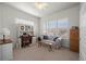 Comfortable home office featuring built-in shelving and a desk at 12664 Ulster St, Thornton, CO 80602