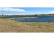 Lake view with grassy area at 12664 Ulster St, Thornton, CO 80602