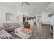 Open living area with hardwood floors, fireplace and large windows at 12664 Ulster St, Thornton, CO 80602
