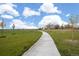 Walking path in a green park area at 12664 Ulster St, Thornton, CO 80602