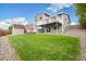 Backyard showcasing a two-tiered deck, lush green lawn, shed, and landscaping, perfect for outdoor activities at 11131 Seton Pl, Westminster, CO 80031