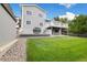 Exterior view of the house showcasing a two-tiered deck with a shed and green lawn at 11131 Seton Pl, Westminster, CO 80031