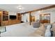 Finished basement with built-in shelving, entertainment center and neutral colored carpet, providing a cozy atmosphere at 11131 Seton Pl, Westminster, CO 80031