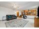 Finished basement features tile flooring, stairs to the upper level, and comfortable seating at 11131 Seton Pl, Westminster, CO 80031