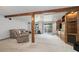 Spacious basement featuring a sliding glass door, an entertainment center, and comfortable seating at 11131 Seton Pl, Westminster, CO 80031