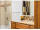 Elegant bathroom with a vanity, granite countertop, and decorative tile backsplash, plus a bathtub at 11131 Seton Pl, Westminster, CO 80031