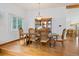 Elegant dining room featuring a large wooden table, chairs, and ample natural light at 11131 Seton Pl, Westminster, CO 80031