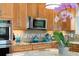Well-appointed kitchen with granite countertops, stainless steel appliances, modern backsplash, and custom wood cabinetry at 11131 Seton Pl, Westminster, CO 80031