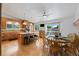 Spacious kitchen and dining area with wood cabinets, a center island, and large windows at 11131 Seton Pl, Westminster, CO 80031