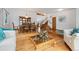 Open living and dining area with hardwood floors and staircase at 11131 Seton Pl, Westminster, CO 80031