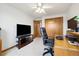 Functional office with a desk, chair, and closet, featuring a TV for breaks or presentations at 11131 Seton Pl, Westminster, CO 80031
